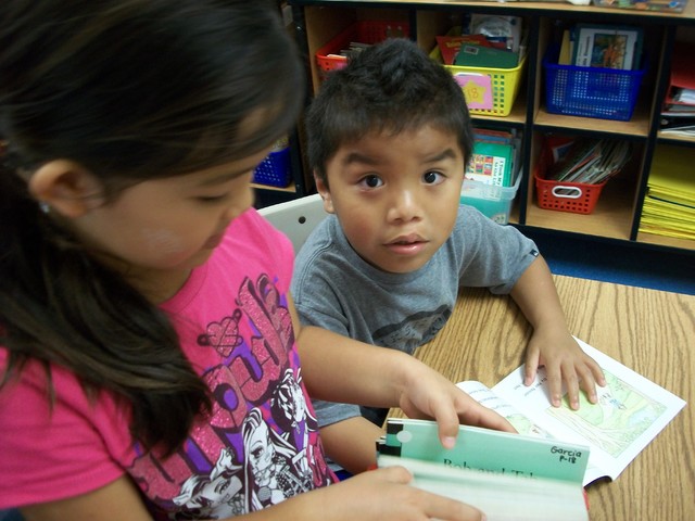 1707441_web1_Mallory-Okoji-reads-to-a-preschooler..jpg