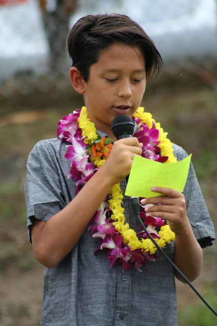 3392338_web1_Charlie-Au-reads-to-the-school-for-May-Day.jpg