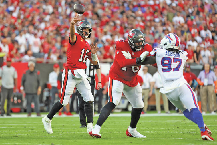 Baker Mayfield throws a TD pass in his bid to follow Tom Brady as