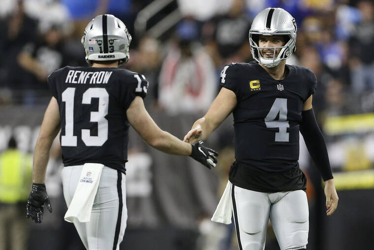 Carson councilman with split Chargers/Raiders jersey (Photo)