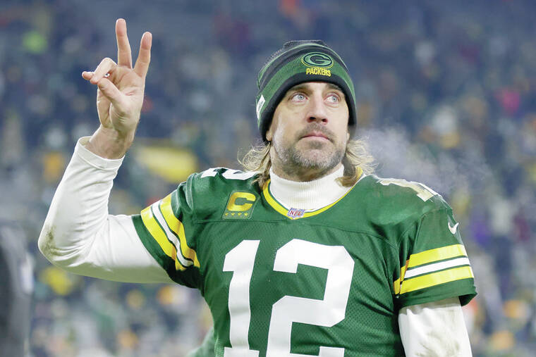 Aaron Rodgers: Star quarterback says he will stay with the Green