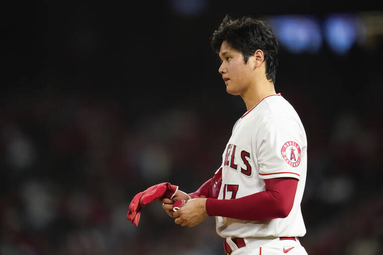 Los Angeles Angels Shohei Ohtani (17) interacts with third baseman