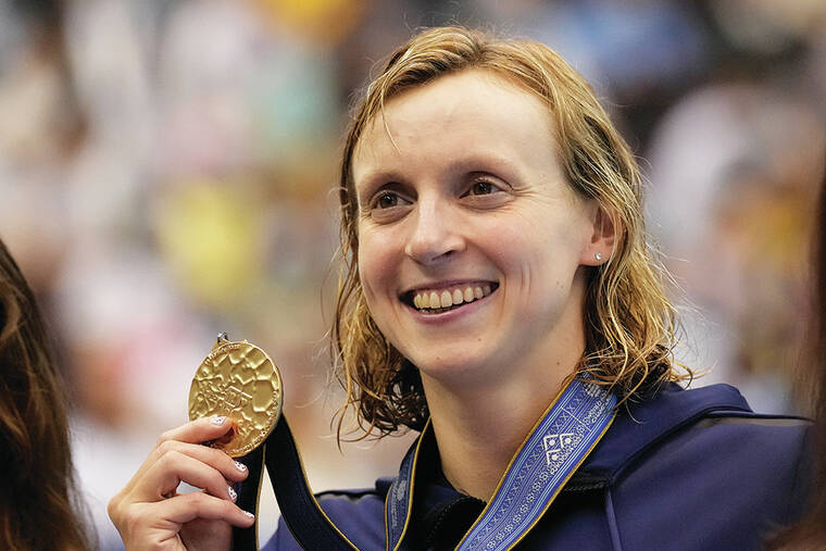 Katie Ledecky wins gold in 1,500 at the swimming worlds to tie mark set