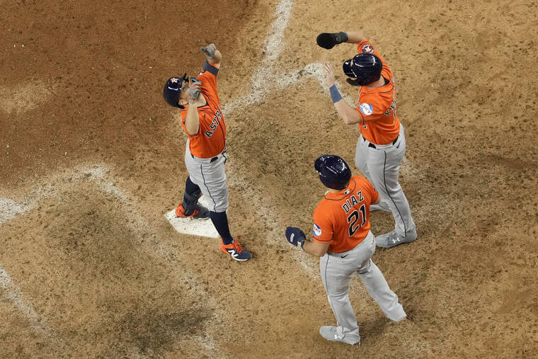 Houston Astros catcher Yainer Diaz walks to the plate after a